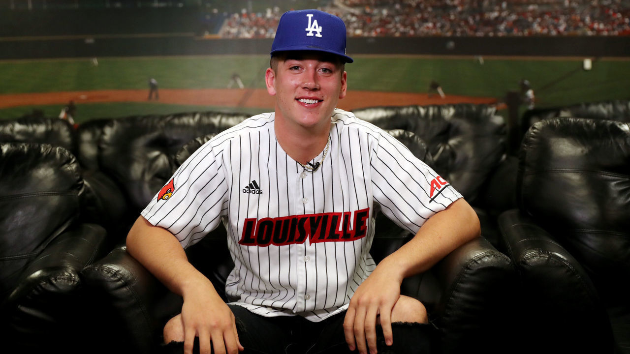SECAUCUS, NJ - JUNE 10: Bobby Miller poses for a photo with a Dodgers hat after being drafted 29th overall by the Los Angeles Dodgers during the 2020 Major League Baseball Draft at MLB Network on Wednesday, June 10, 2020 in Secaucus, New Jersey.