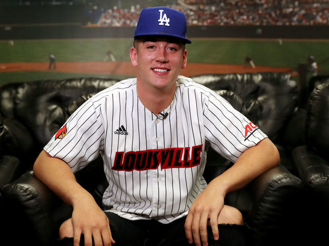 SECAUCUS, NJ - JUNE 10: Bobby Miller poses for a photo with a Dodgers hat after being drafted 29th overall by the Los Angeles Dodgers during the 2020 Major League Baseball Draft at MLB Network on Wednesday, June 10, 2020 in Secaucus, New Jersey.