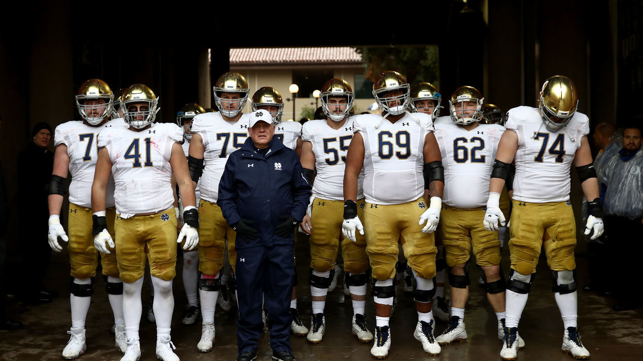 PALO ALTO, CALIFORNIA - NOVEMBER 30: Head coach Brian Kelly of the Notre Dame Fighting Irish waits in the tunnel with his players before they take the field for their game against the Stanford Cardinal at Stanford Stadium on November 30, 2019 in Palo Alto, California.