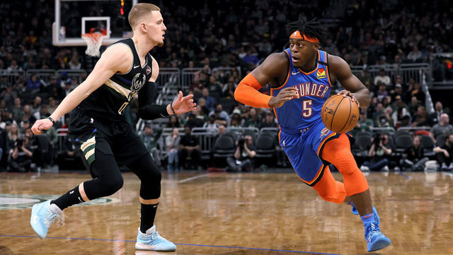 MILWAUKEE, WISCONSIN - FEBRUARY 28: Luguentz Dort #5 of the Oklahoma City Thunder dribbles the ball while being guarded by Donte DiVincenzo #0 of the Milwaukee Bucks in the third quarter at the Fiserv Forum on February 28, 2020 in Milwaukee, Wisconsin.