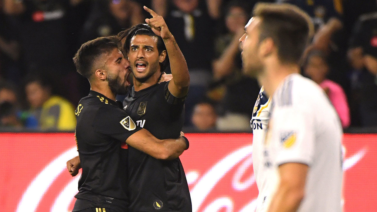 LOS ANGELES, CALIFORNIA - OCTOBER 24: Carlos Vela #10 of Los Angeles FC celebrates his goal with Diego Rossi #9, to take a 1-0 lead over the Los Angeles Galaxy, during the first half of the Western Conference Semifinals at Banc of California Stadium on October 24, 2019 in Los Angeles, California.