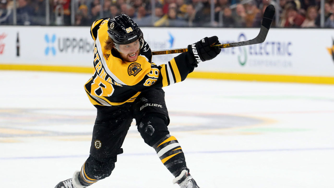 BOSTON, MASSACHUSETTS - FEBRUARY 25: David Pastrnak #88 of the Boston Bruins takes a shot against the Calgary Flames during the first period at TD Garden on February 25, 2020 in Boston, Massachusetts.