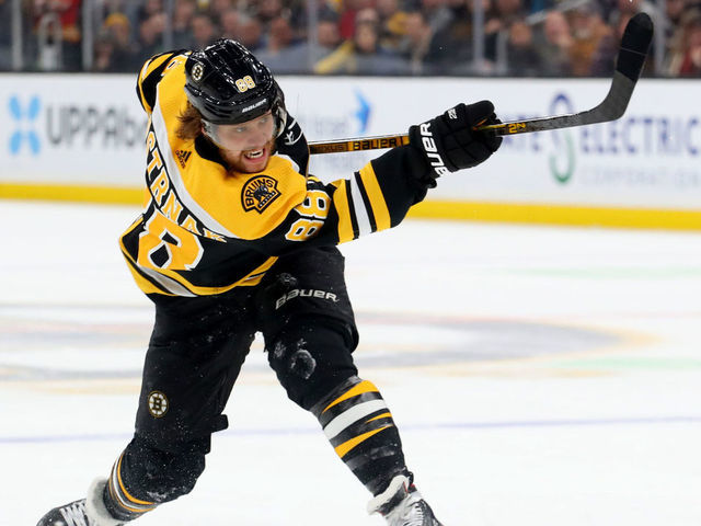 BOSTON, MASSACHUSETTS - FEBRUARY 25: David Pastrnak #88 of the Boston Bruins takes a shot against the Calgary Flames during the first period at TD Garden on February 25, 2020 in Boston, Massachusetts.