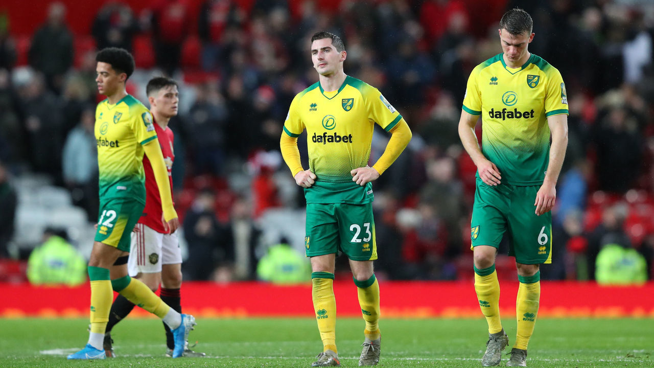 MANCHESTER, ENGLAND - JANUARY 11: Kenny McLean and Christoph Zimmermann of Norwich City look dejected following the Premier League match between Manchester United and Norwich City at Old Trafford on January 11, 2020 in Manchester, United Kingdom.