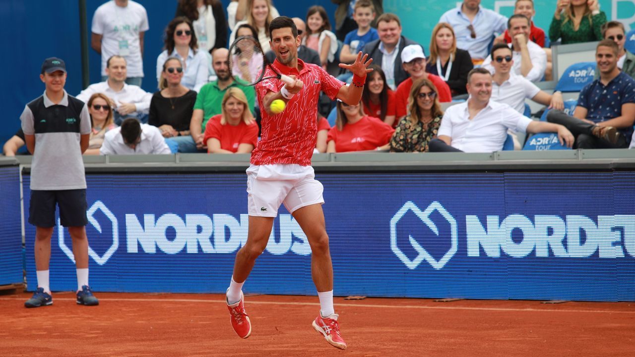 BELGRADE, SERBIA - JUNE 12: Tennis player Novak Djokovic returns the ball during a tennis doubles match at the court of the Novak Tennis Center following the opening program of the Adria Tour, a charity exhibition hosted by Novak Djokovic Foundation on June 12, 2020 in Belgrade, Serbia. Grigor Dimitrov, Novak Djokovic, Dominic Thiem and Alexander Zverev will return to tennis courts after the mandatory suspension since March due to the novel coronavirus (COVID-19) pandemic.