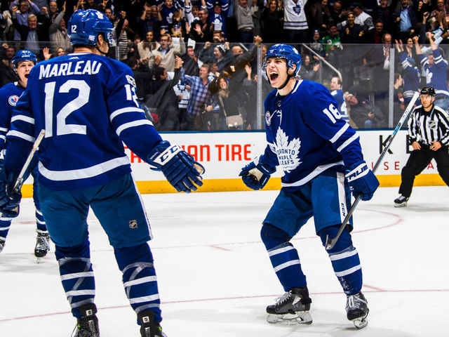 TORONTO, ON - NOVEMBER 10: Patrick Marleau #12 of the Toronto Maple Leafs celebrates his game winning overtime e goal on the Boston Bruins with teammate Mitch Marner at the Air Canada Centre on November 10, 2017 in Toronto, Ontario, Canada.