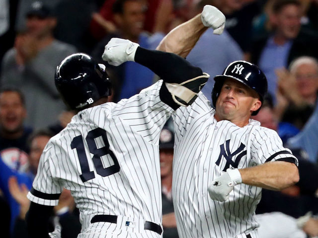 NEW YORK NY - OCTOBER 03 Didi Gregorius 18 of the New York Yankees celebrates with Brett Gardner 11 after hitting a three run home run against Ervin Santana 54 of the Minnesota Twins during the first inning in the American League Wild Card Game at Yankee Stadium on October 3 2017 in the Bronx borough of New York City