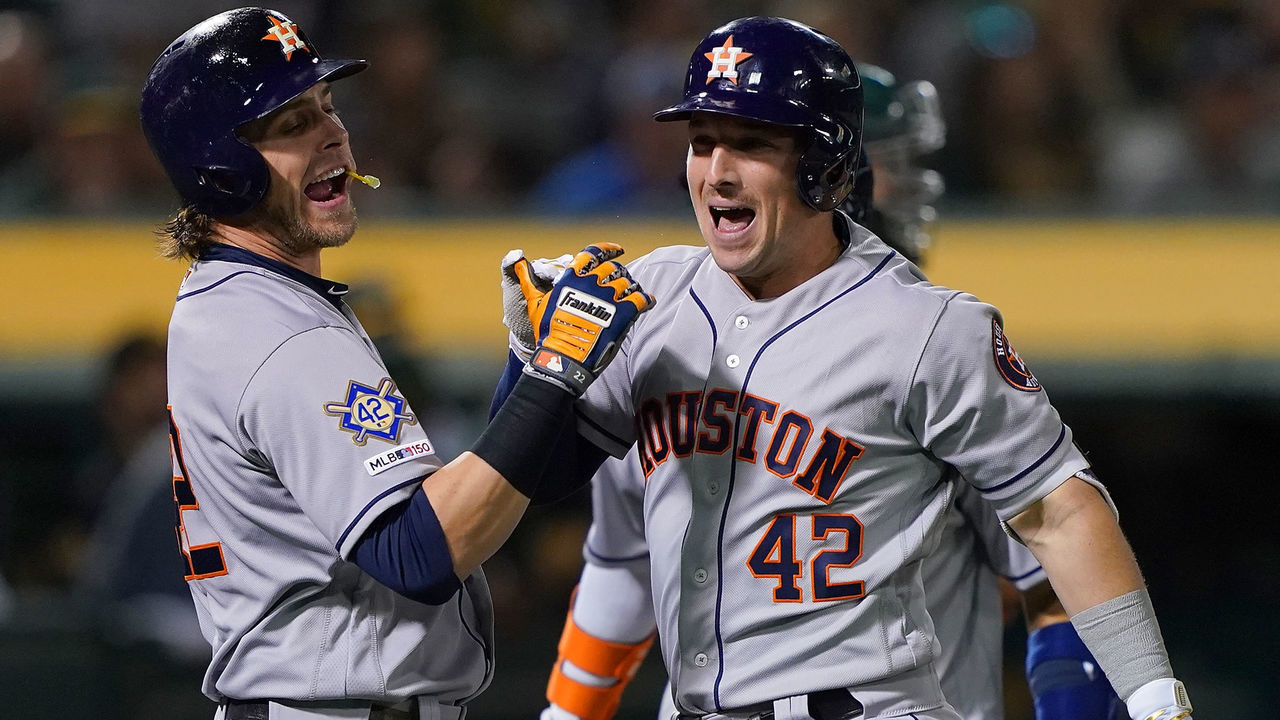 OAKLAND, CA - APRIL 16: Alex Bregman #2 (R) and Josh Reddick #22 (L) of the Houston Astros celebrates after Bregman hit a grand slam home run against the Oakland Athletics in the top of the fourth inning of a Major League Baseball game at Oakland-Alameda County Coliseum on April 16, 2019 in Oakland, California. All uniformed players and coaches are wearing number 42 in honor of Jackie Robinson Day.