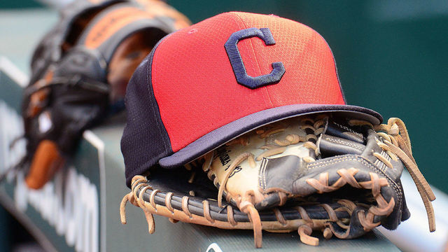 KANSAS CITY, MO - JULY 03: A Cleveland Indians cap and glove as seen before a Major League Baseball game between the Cleveland Indians and the Kansas City Royals on July 03, 2019, at Kauffman Stadium, Kansas City, Mo.