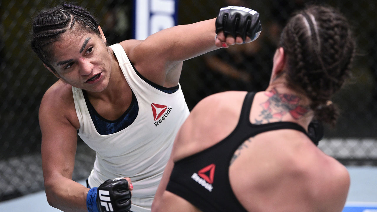LAS VEGAS, NEVADA - JUNE 13: (L-R) Cynthia Calvillo punches Jessica Eye in their flyweight fight during the UFC Fight Night event at UFC APEX on June 13, 2020 in Las Vegas, Nevada.