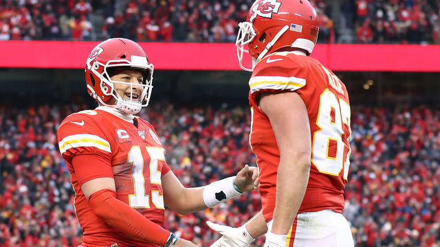 KANSAS CITY, MISSOURI - JANUARY 12: Patrick Mahomes #15 of the Kansas City Chiefs is congratulated by his teammate Travis Kelce #87 after a third quarter touchdown against the Houston Texans in the AFC Divisional playoff game at Arrowhead Stadium on January 12, 2020 in Kansas City, Missouri.