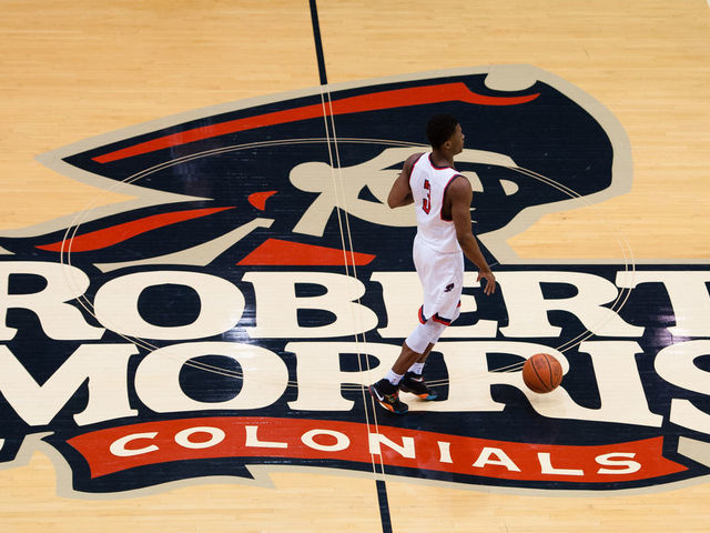 February 6 2016: Robert Morris Colonials guard Kavon Stewart (3) brings the ball up court over the Robert Morris Colonials logo on the floor during the second half in the NCAA Basketball game between the Bryant University Bulldogs and the Robert Morris Colonials at the Charles L. Sewall Center in Moon Township, Pennsylvania