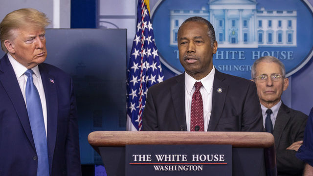 WASHINGTON, DC - MARCH 21: U.S. President Donald Trump listens to U.S. Housing and Urban Development Secretary Ben Carson speak during a briefing in the James Brady Press Briefing Room at the White House on March 21, 2020 in Washington, DC. With deaths caused by the coronavirus rising and foreseeable economic turmoil, the Senate is working on legislation for a $1 trillion aid package to deal with the COVID-19 pandemic. President Trump announced that tax day will be delayed from April 15 to July 15.