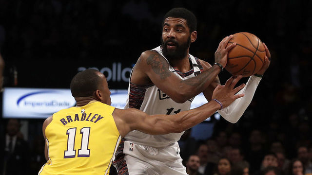 NEW YORK, NEW YORK - JANUARY 23: (NEW YORK DAILIES OUT) Kyrie Irving #11 of the Brooklyn Nets in action against Avery Bradley #11 of the Los Angeles Lakers at Barclays Center on January 23, 2020 in New York City. The Lakers defeated the Nets 128-113.