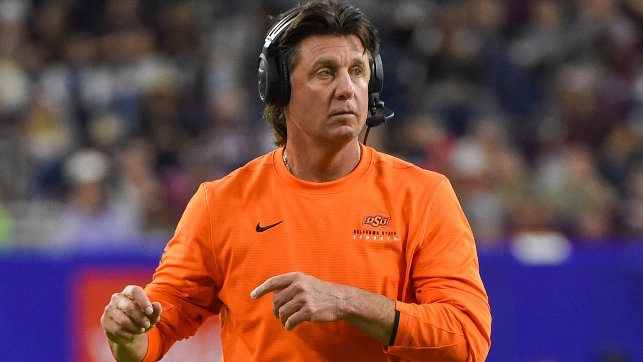HOUSTON, TX - DECEMBER 27: Oklahoma State Cowboys head coach Mike Gundy looks on during late second half action during the football game between the Oklahoma State Cowboys and Texas A&M Aggies at NRG Stadium on December 27, 2019 in Houston, TX.