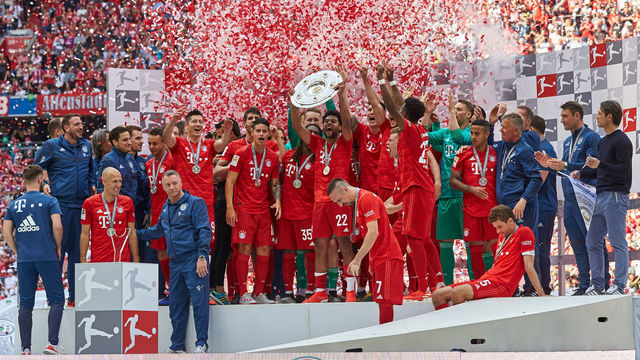 MUNICH, GERMANY - MAY 18: Players of FC Bayern Muenchen celebrate with the championship trophy after the Bundesliga match between FC Bayern Muenchen and Eintracht Frankfurt at Allianz Arena on May 18, 2019 in Munich, Germany.