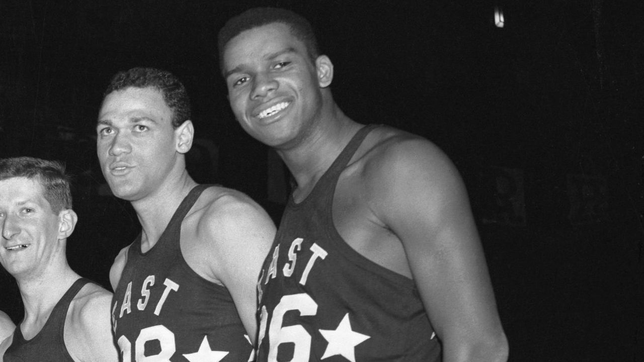 (Original Caption) To Face West All-Stars. New York: Here are the coach and members of the East All-Star team which will meet a team of West All-Stars at Madison Square Garden Saturday evening. Coach is Ken Leoffler of La Salle. The boys (LTR) are: Bill Evans (Kentucky), Buzzy Wilkinson (Virginia), Ed Fleming (Niagara), Dick Hemric (Wake Forest), Jesse Arnelle (Penn State), Ed Conlin (Fordham), Tom Gola (La Salle), Walt Devlin (George Washington), Dick Ricketts (Duquesne) and Maurice Stokes (St. Francis, P.A.).