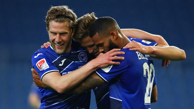 BIELEFELD, GERMANY - JUNE 15: Cebio Soukou of Bielefeld celebrates scoring his team's fourth goal with Sven Schipplock and Fabian Kunze during the Second Bundesliga match between DSC Arminia Bielefeld and SG Dynamo Dresden at Schueco Arena on June 15, 2020 in Bielefeld, Germany.
