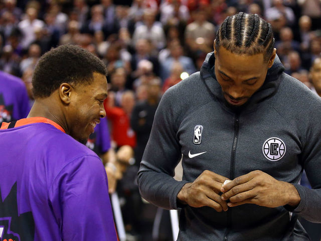 TORONTO, ON - DECEMBER 11: Kyle Lowry (L) of the Toronto Raptors presents Kawhi Leonard (R) of the Los Angeles Clippers with his Championship Ring prior to an NBA game at Scotiabank Arena on December 11, 2019 in Toronto, Canada.