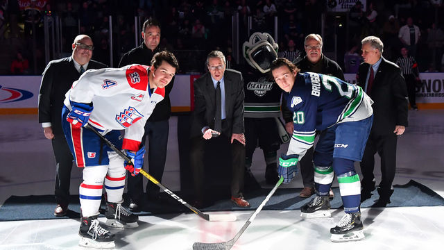 KENT, WASHINGTON - DECEMBER 10: U.S. Challenge Cup members (l-r), Bil La Forge - Seattle Thunderbirds GM, Dan Leiweke - NHL Seattle, Andrew Hutchison - GM Best Western Plaza, Les Grauer - Kent Valley Ice Centre, and Ron Robinson - WHL Commissioner, participate in a puck drop with Noah King #4 of the Spokane Chiefs, and Conner Bruggen-Cate #20 of the Seattle Thunderbirds before the match at the accesso ShoWare Center on December 10, 2019 in Kent, Washington.