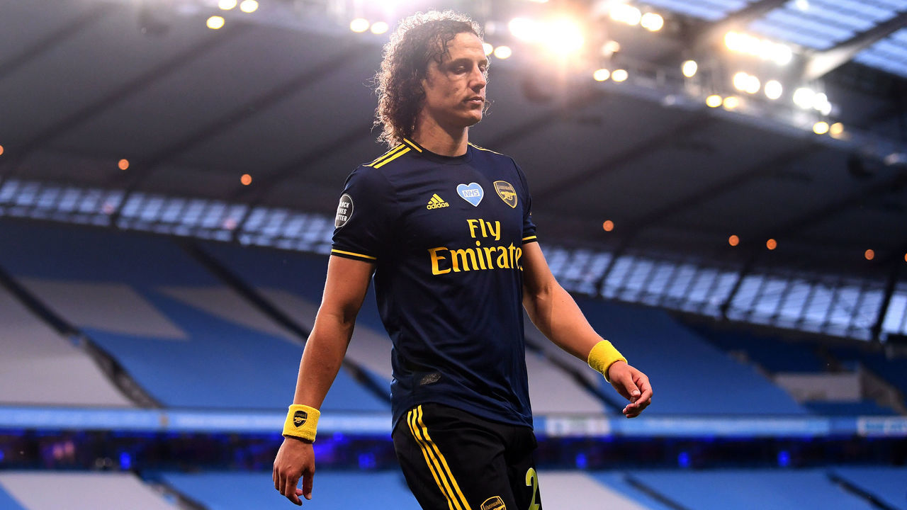MANCHESTER, ENGLAND - JUNE 17: David Luiz of Arsenal walks along the touchline after being sent off during the Premier League match between Manchester City and Arsenal FC at Etihad Stadium on June 17, 2020 in Manchester, United Kingdom.