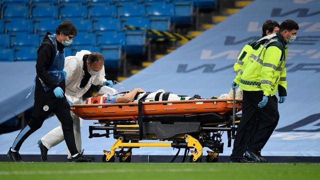 Manchester City's Spanish defender Eric Garcia is stretchered off the pitch after colliding with Manchester City's Brazilian goalkeeper Ederson during the English Premier League football match between Manchester City and Arsenal at the Etihad Stadium in Manchester, north west England, on June 17, 2020. - The Premier League makes its eagerly anticipated return today after 100 days in lockdown but behind closed doors due to coronavirus restrictions.