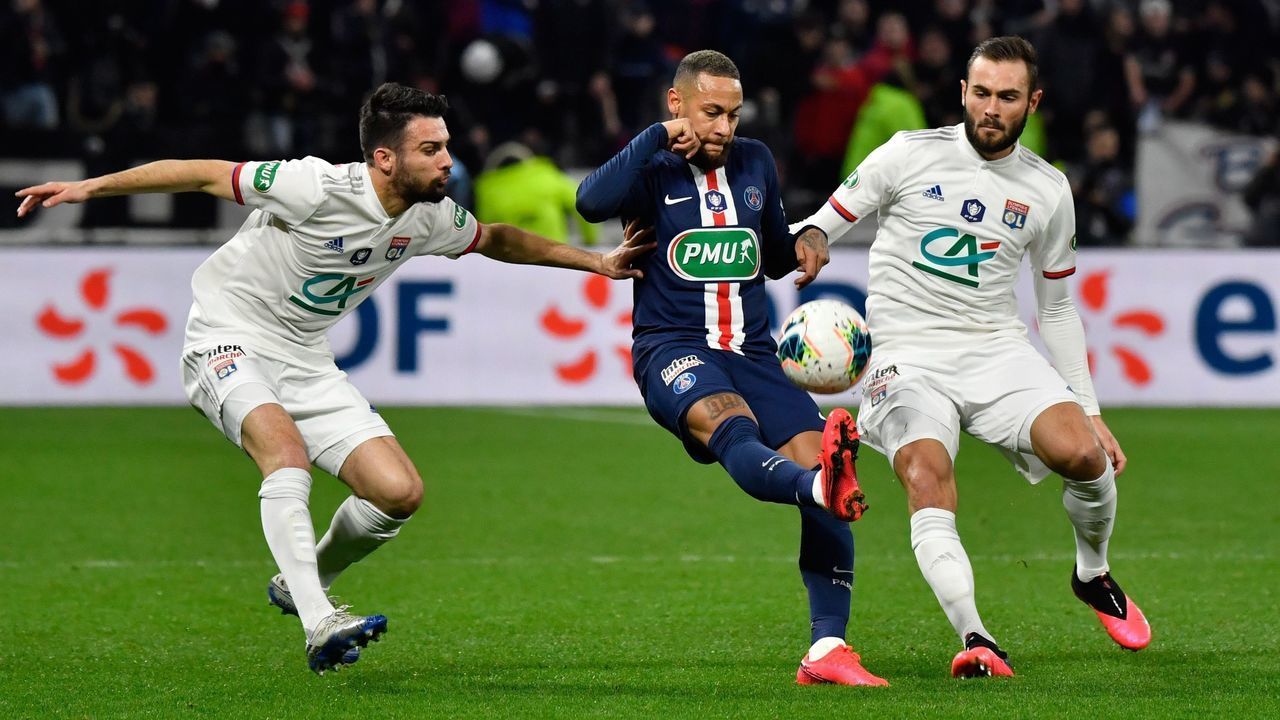 Paris Saint-Germain's Brazilian forward Neymar (C) fights for the ball with Lyon's French defender Leo Dubois (L) and Lyon's French midfielder Lucas Tousart during the French Cup semi-final football match between Olympique Lyonnais (OL) and Paris Saint-Germain (PSG) at the Groupama Stadium in Decines-Charpieu, centraleastern France, on March 4, 2020.
