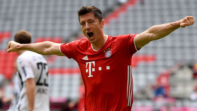 Bayern Munich's Polish forward Robert Lewandowski celebrates after scoring his team's second goal during the German first division Bundesliga football match FC Bayern Munich v SC Freiburg on June 20, 2020 in Munich, southern Germany.