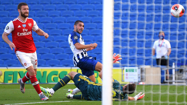 BRIGHTON, ENGLAND - JUNE 20: Neal Maupay of Brighton and Hove Albion scores his team's second goal past Emiliano Martinez of Arsenal during the Premier League match between Brighton & Hove Albion and Arsenal FC at American Express Community Stadium on June 20, 2020 in Brighton, England. Football Stadiums around Europe remain empty due to the Coronavirus Pandemic as Government social distancing laws prohibit fans inside venues resulting in all fixtures being played behind closed doors.