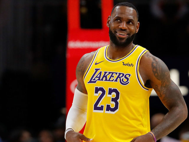 ATLANTA, GEORGIA - DECEMBER 15: LeBron James #23 of the Los Angeles Lakers enjoys a laugh during the first half against the Atlanta Hawks at State Farm Arena on December 15, 2019 in Atlanta, Georgia. NOTE TO USER: User expressly acknowledges and agrees that, by downloading and/or using this photograph, user is consenting to the terms and conditions of the Getty Images License Agreement.
