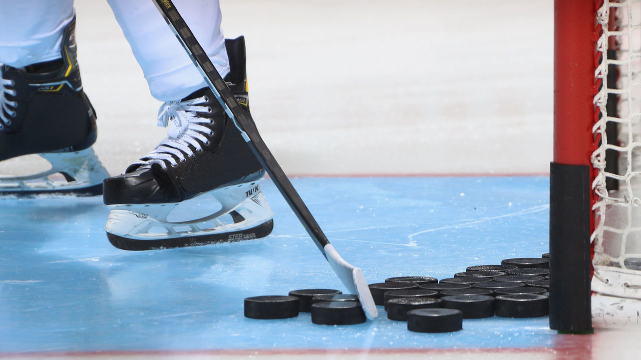 UNIONDALE, NEW YORK - SEPTEMBER 17: A closeup of pucks, a stick and skates as photographed during warm-ups prior to the game between the New York Islanders and the Philadelphia Flyers at the Nassau Veterans Memorial Coliseum on September 17, 2019 in Uniondale, New York. The Islanders defeated the Flyers 3-2 in overtime.