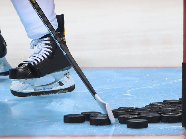 UNIONDALE, NEW YORK - SEPTEMBER 17: A closeup of pucks, a stick and skates as photographed during warm-ups prior to the game between the New York Islanders and the Philadelphia Flyers at the Nassau Veterans Memorial Coliseum on September 17, 2019 in Uniondale, New York. The Islanders defeated the Flyers 3-2 in overtime.