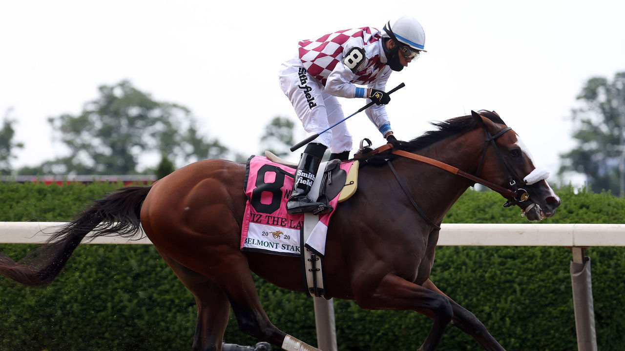 ELMONT, NEW YORK - JUNE 20: Jockey Manuel Franco celebrates atop Tiz the Law #8 after crossing the finish line to win the 152nd running of the Belmont Stakes at Belmont Park on June 20, 2020 in Elmont, New York.