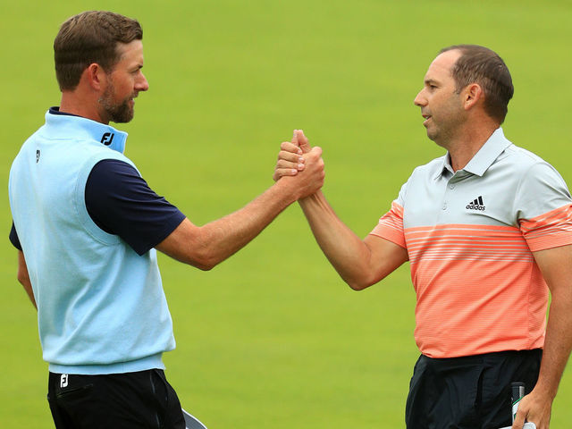 PORTRUSH, NORTHERN IRELAND - JULY 19: Webb Simpson of the United States shakes hands with Sergio Garcia of Spain on the 18th green during the second round of the 148th Open Championship held on the Dunluce Links at Royal Portrush Golf Club on July 19, 2019 in Portrush, United Kingdom.