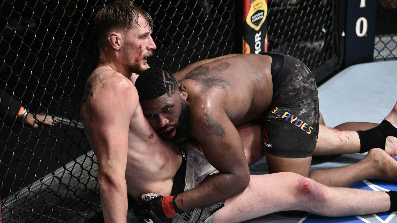 LAS VEGAS, NEVADA - JUNE 20: (R-L) Curtis Blaydes takes down Alexander Volkov of Russia in their heavyweight bout during the UFC Fight Night event at UFC APEX on June 20, 2020 in Las Vegas, Nevada.
