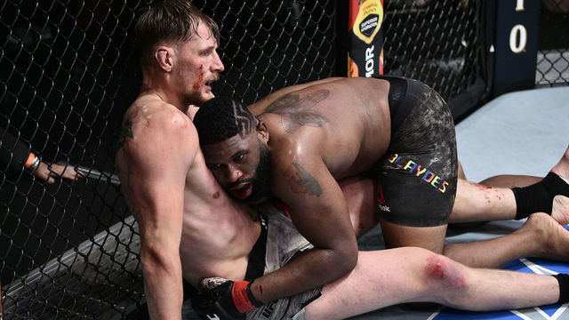 LAS VEGAS, NEVADA - JUNE 20: (R-L) Curtis Blaydes takes down Alexander Volkov of Russia in their heavyweight bout during the UFC Fight Night event at UFC APEX on June 20, 2020 in Las Vegas, Nevada.