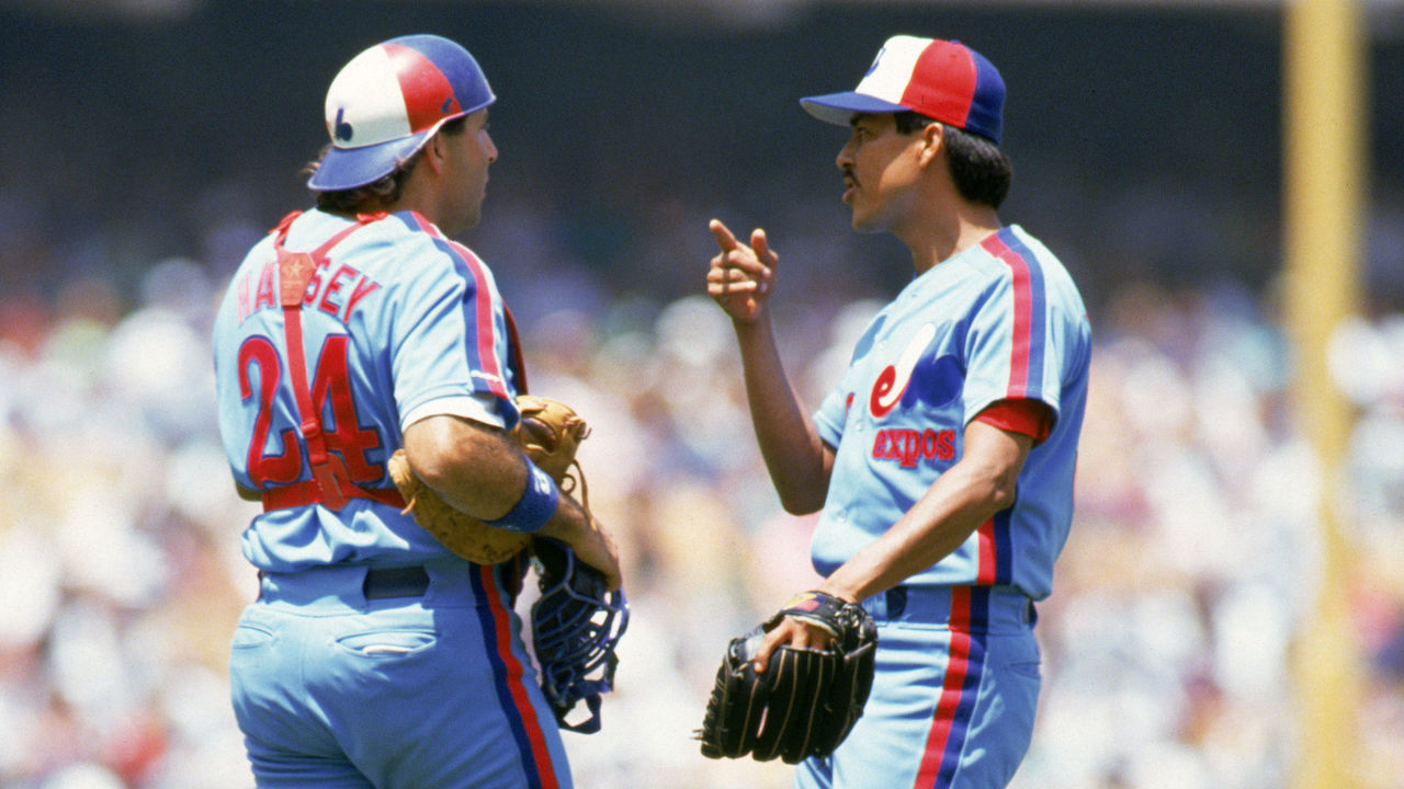 LOS ANGELES - JULY 28: Dennis Martinez #32 of the Montreal Expos talks with catcher Ron Hassey #24 during their game against the Los Angeles Dodgers at Dodger Stadium on July 28, 1991 in Los Angeles, California. Martinez threw a perfect game as the Expos defeated the Dodgers 2-0. (Photo by: Bernstein Associates/Getty Images)