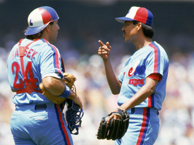 LOS ANGELES - JULY 28: Dennis Martinez #32 of the Montreal Expos talks with catcher Ron Hassey #24 during their game against the Los Angeles Dodgers at Dodger Stadium on July 28, 1991 in Los Angeles, California. Martinez threw a perfect game as the Expos defeated the Dodgers 2-0. (Photo by: Bernstein Associates/Getty Images)