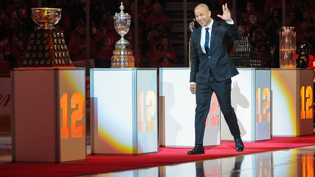 CALGARY, AB - MARCH 2: Jarome Iginla waves to the crowd as he walks onto the ice during the night his number twelve jersey will be retired prior to an NHL game against the Minnesota Wild at Scotiabank Saddledome on March 2, 2019 in Calgary, Alberta, Canada.