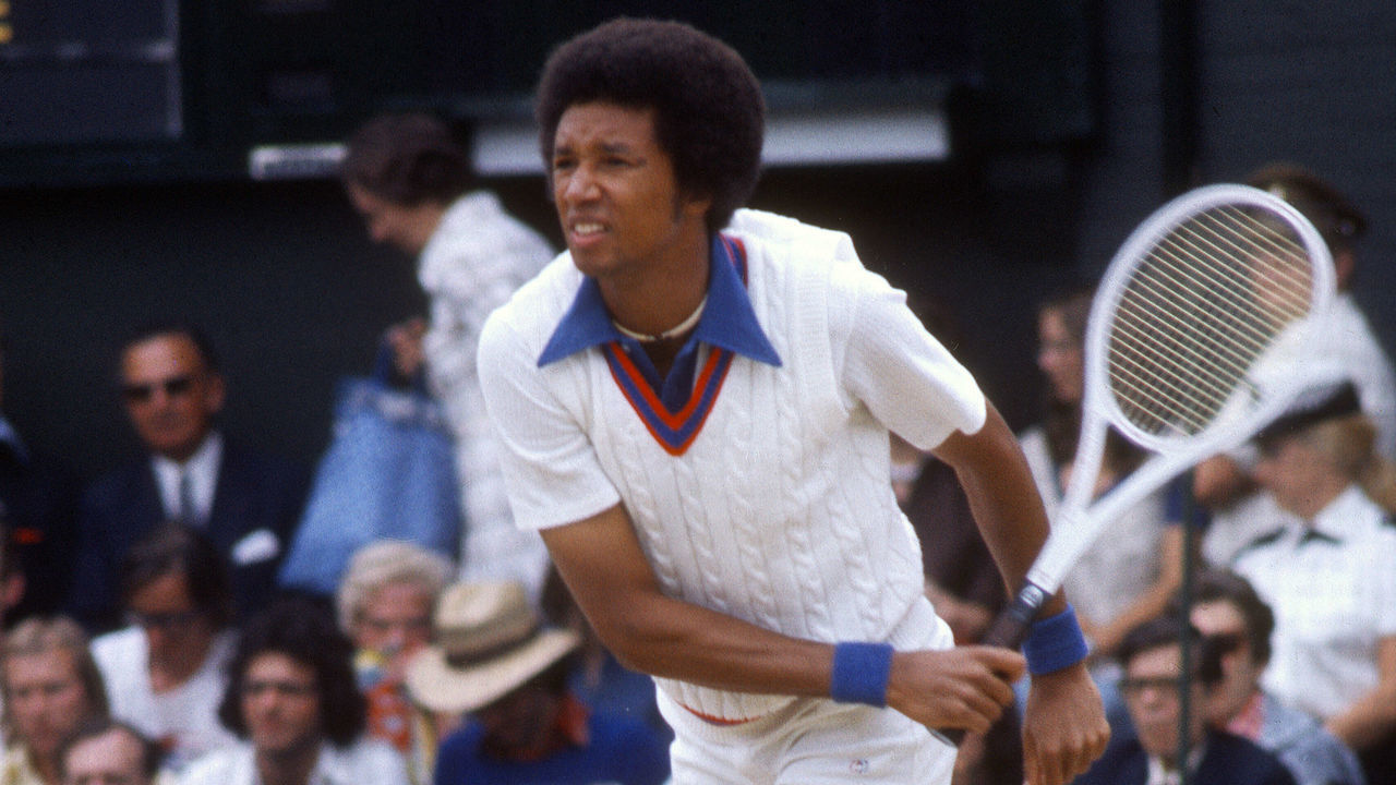 LONDON - CIRCA 1975: Arthur Ashe of The United States serves during a men's singles match at the Wimbledon Lawn Tennis Championships circa 1975 at the All England Lawn Tennis and Croquet Club in London, England.
