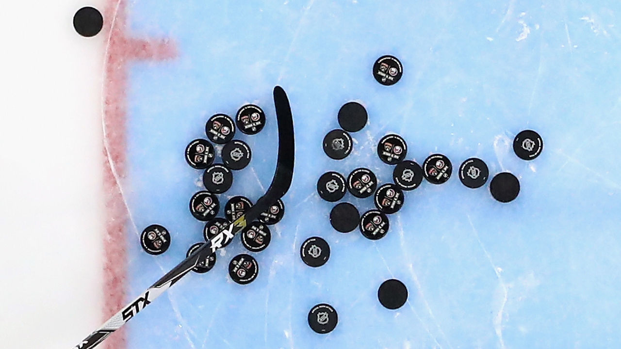 UNIONDALE, NEW YORK - OCTOBER 12: Pucks sit on the ice during warm-ups prior to the game between the Florida Panthers and the New York Islanders at NYCB Live's Nassau Coliseum on October 12, 2019 in Uniondale, New York.