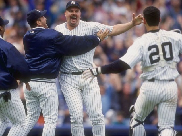 17 May 1998: David Wells #33 of the New York Yankees celebrates his perfect game against the Minnesota Twins with teammates Jorge Posada #20 and Luis Sojo #19 at Yankee Stadium in the Bronx, New York. The Yankees defeated the Twins 4-0.