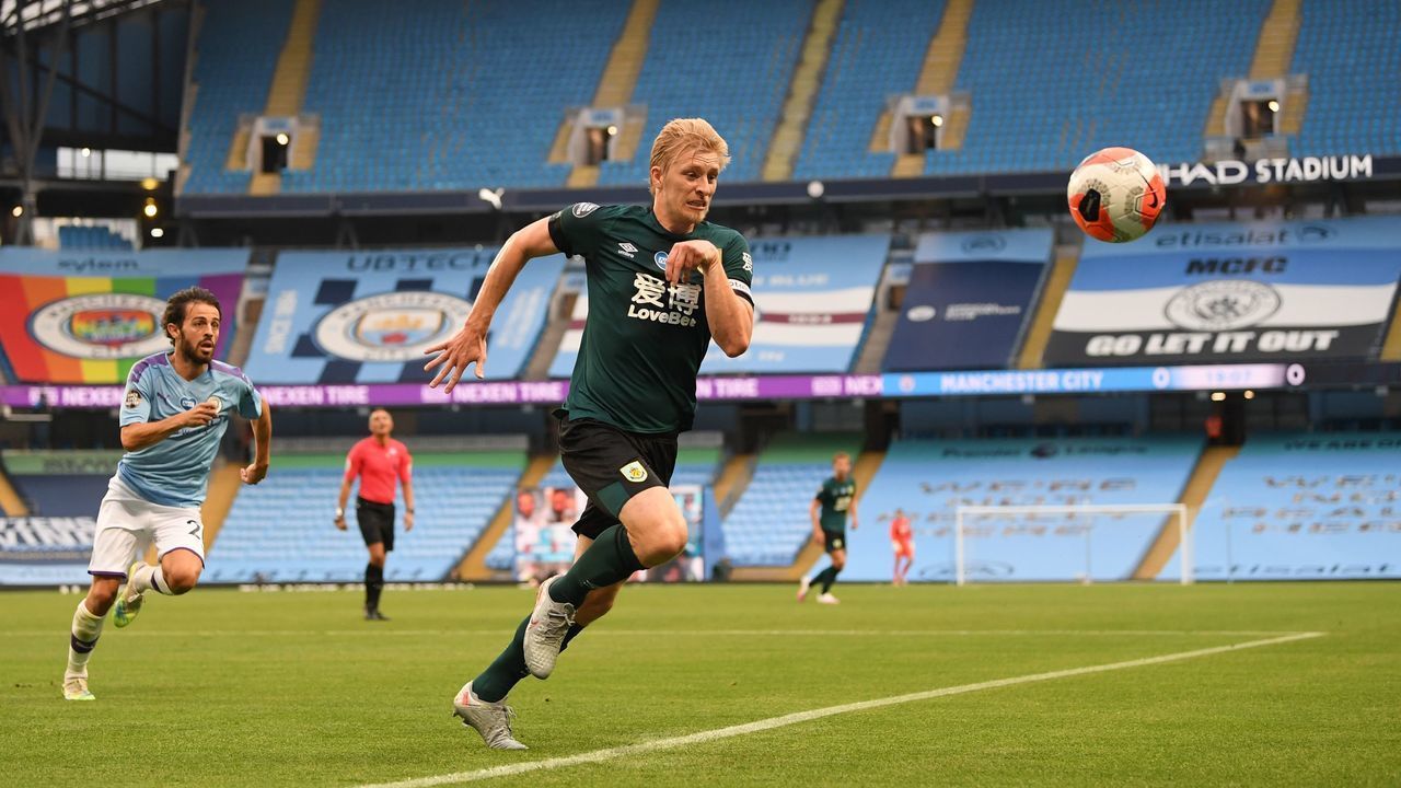 Burnley's English defender Ben Mee chases the ball during the English Premier League football match between Manchester City and Burnley at the Etihad Stadium in Manchester, north west England, on June 22, 2020.