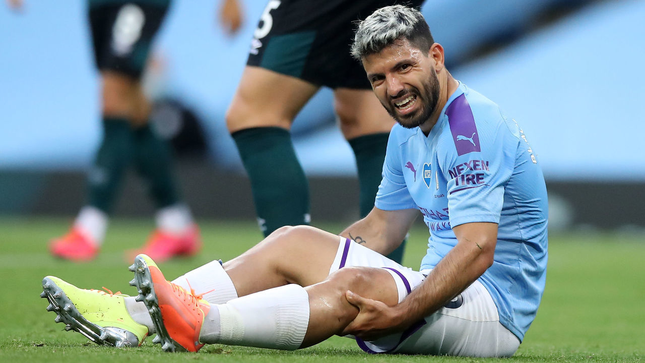 Manchester City's Argentinian striker Sergio Aguero reacts after being injured in a challenge with Burnley's English defender Ben Mee (not pictured) during the English Premier League football match between Manchester City and Burnley at the Etihad Stadium in Manchester, north west England, on June 22, 2020.