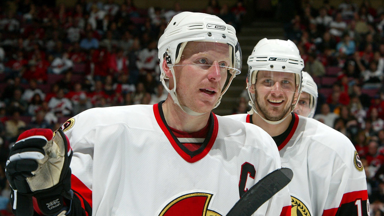 EAST RUTHERFORD, NJ - MAY 05: Daniel Alfredsson #11 of the Ottawa Senators celebrates his second-period goal with teammate Jason Spezza #19 against the New Jersey Devils during Game Five of the 2007 Eastern Conference Semifinals at the Continental Airlines Arena in the Meadowlands on May 5, 2007 in East Rutherford, New Jersey.