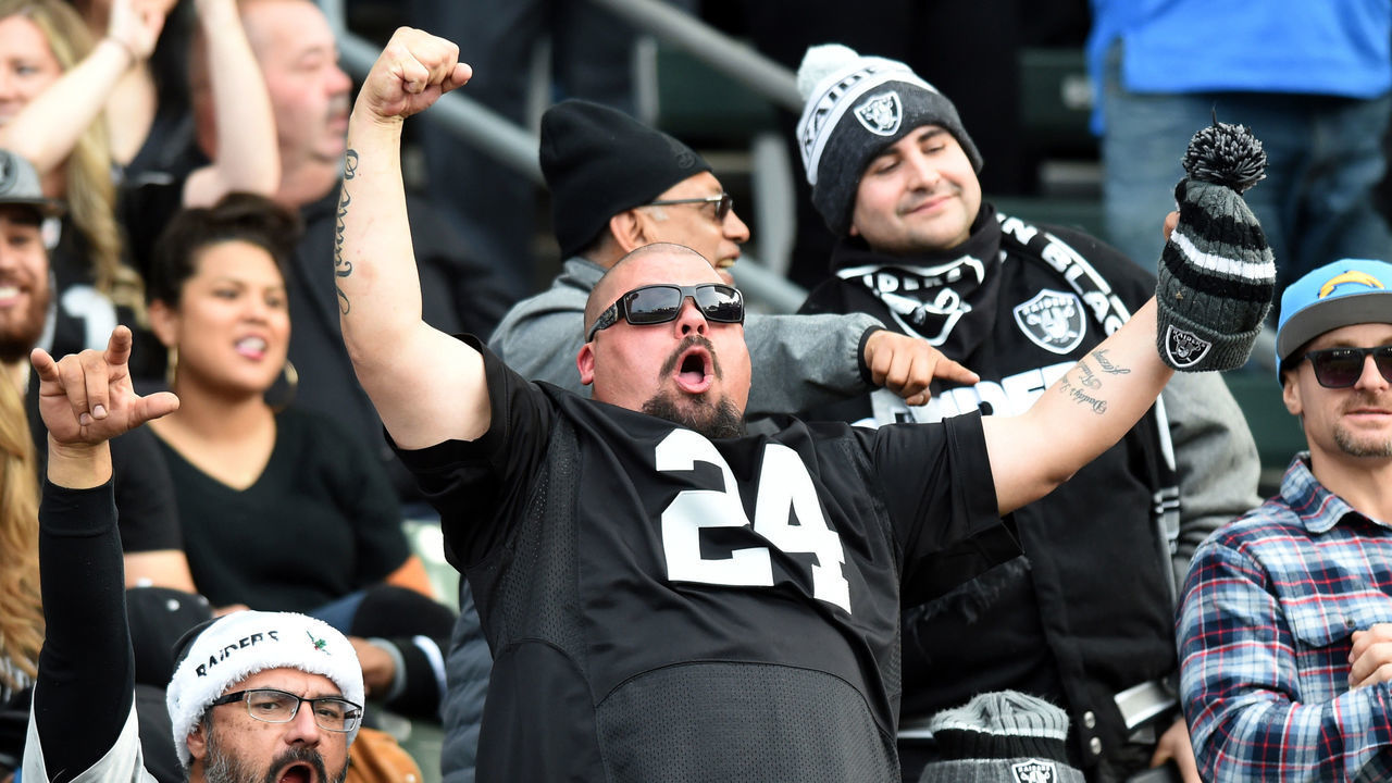 CARSON, CA - DECEMBER 22: A Raiders fan celebrates after the crowd threw back souvenir t-shirts during an NFL game between the Oakland Raiders and the Los Angeles Chargers on December 22, 2019, at Dignity Health Sports Park in Carson, CA.