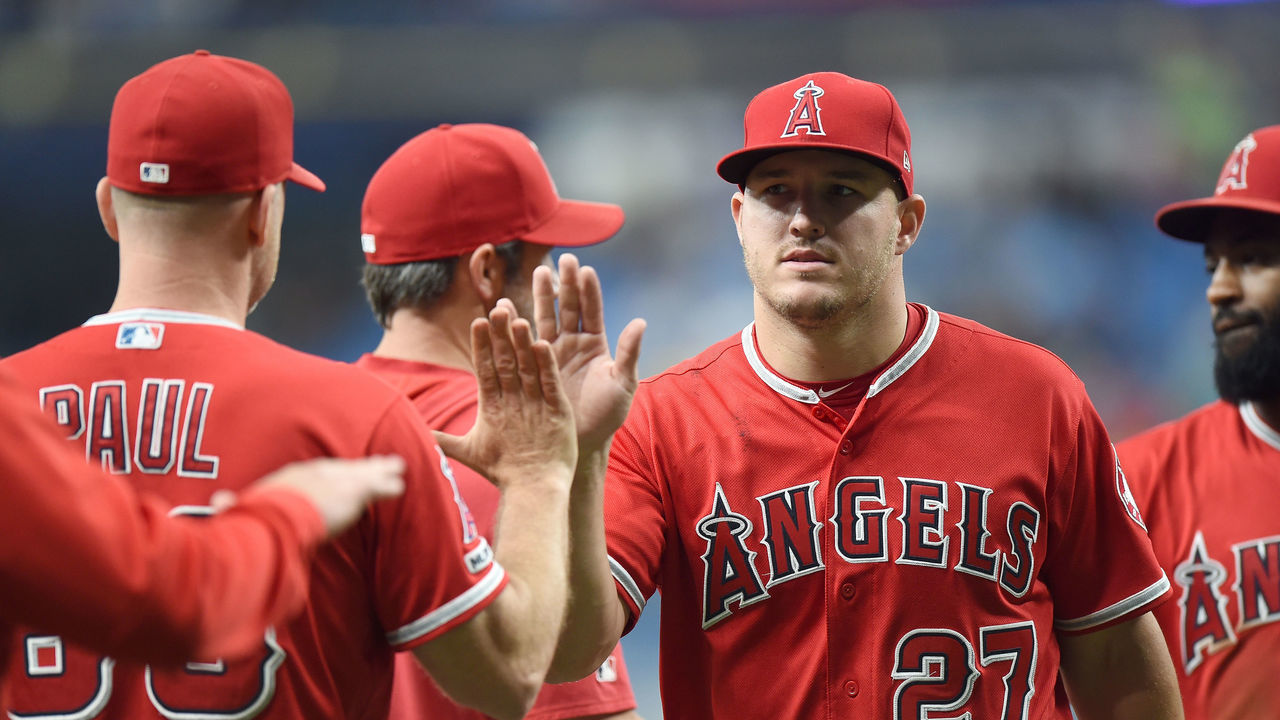 ST PETERSBURG, FL - JUNE 15: Mike Trout #27 of the Los Angeles Angels celebrates with teammates after a victory against the Tampa Bay Rays at Tropicana Field on June 15, 2019 in St Petersburg, Florida.