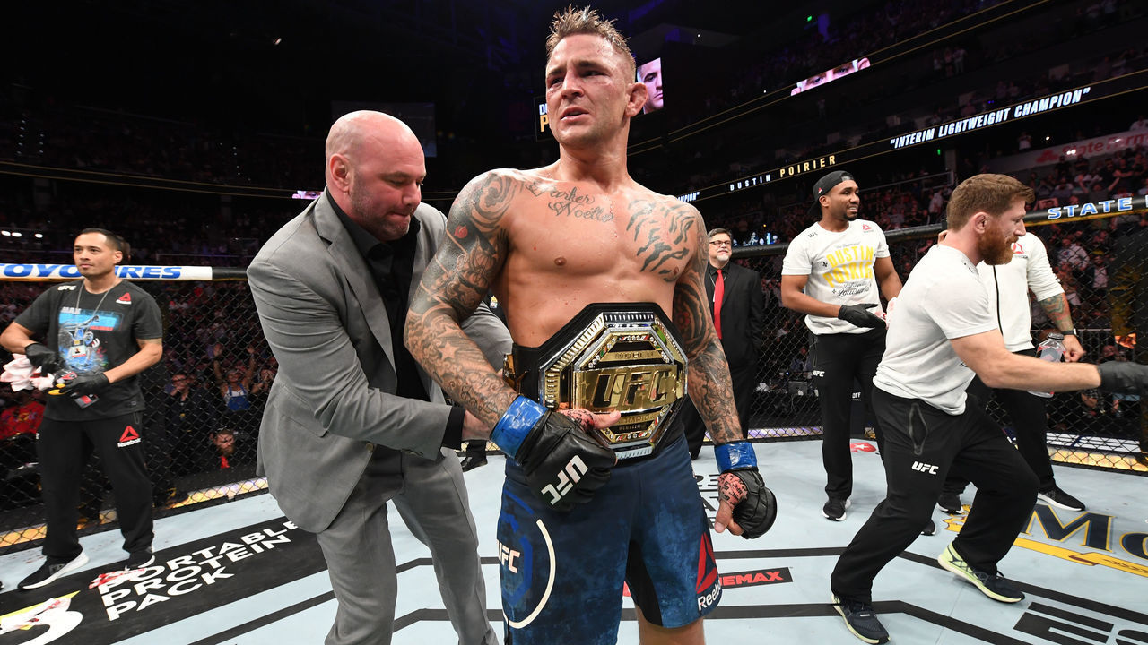 ATLANTA, GA - APRIL 13: (L-R) UFC President Dana White places the interim lightweight championship belt on Dustin Poirier after defeating Max Holloway in their interim lightweight championship bout during the UFC 236 event at State Farm Arena on April 13, 2019 in Atlanta, Georgia.