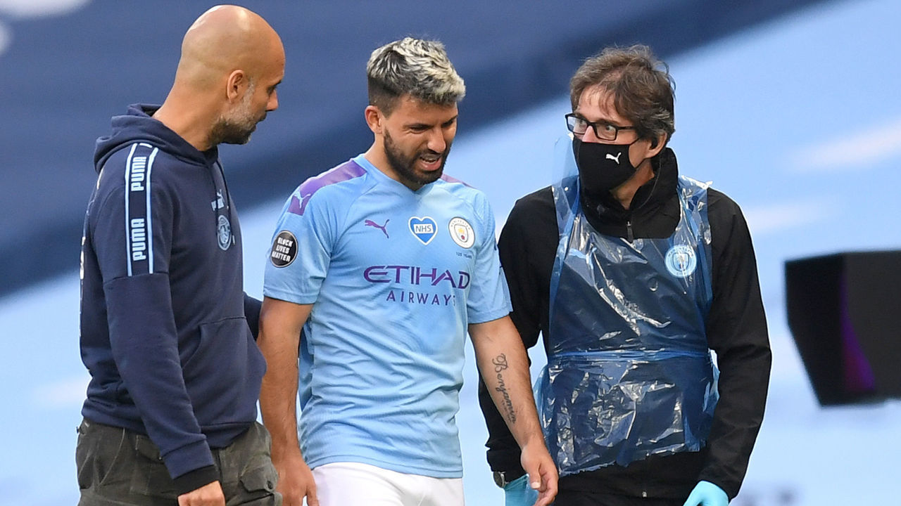 MANCHESTER, ENGLAND - JUNE 22: Sergio Aguero of Manchester City comes off the pitch injured as he speaks with Pep Guardiola, Manager of Manchester City during the Premier League match between Manchester City and Burnley FC at Etihad Stadium on June 22, 2020 in Manchester, England. Football stadiums around Europe remain empty due to the Coronavirus Pandemic as Government social distancing laws prohibit fans inside venus resulting in all fixtures being played behind closed doors.