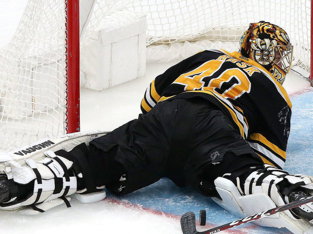 BOSTON - NOVEMBER 21: Boston Bruins goaltender Tuukka Rask (40) makes a diving, sprawling save with the Buffalo Sabres on the power play and the score at 3-1 in the third period. The Boston Bruins host the Buffalo Sabres in a regular season NHL hockey game at TD Garden in Boston on Nov. 21, 2019.